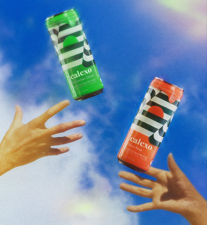 Two Calexo cans in front of a blue sky